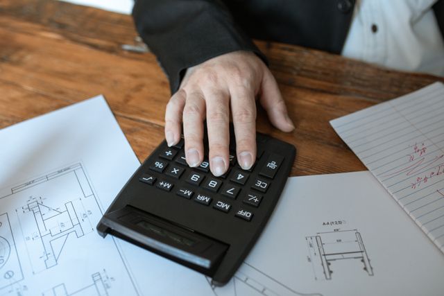 a person using a calculator